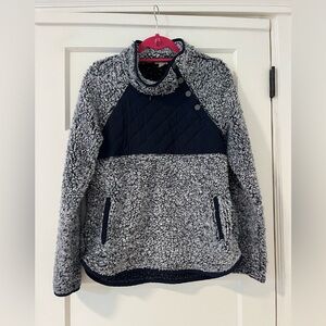 Fleece asymmetrical button front sweater.